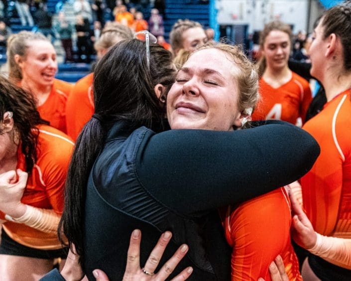 OAKVILLE, ON – FEB. 25, 2023: Mohawk Mountaineers players celebrate following the Ontario Colleges Athletic Association Women's Volleyball third place game against the Seneca Sting.