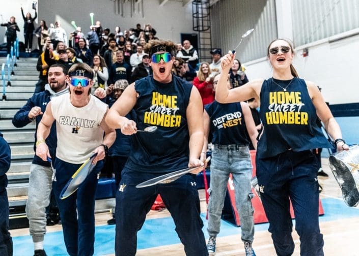 OAKVILLE, ON – FEB. 25, 2023: Humber Hawks fans celebrate during the Ontario Colleges Athletic Association Women's Volleyball Championship game.